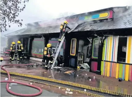  ?? LONDON FIRE BRIGADE ?? Firefighte­rs damping down after they tackled a blaze at London Zoo