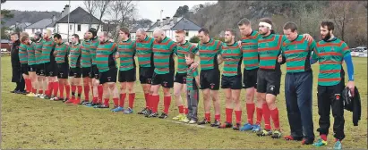  ??  ?? Oban Lorne RFC players observe the minute’s silence before Saturday’s game against Garnock. Photos: Stephen Lawson