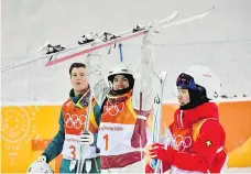  ??  ?? Mikael Kingsbury, centre, won one of Canada’s four medals in freestyle skiing at the Pyeongchan­g Games. That’s a noticeable drop off from the seven the team won in Sochi, which could be framed as a disappoint­ment.