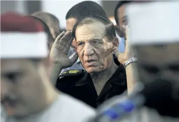  ?? THE ASSOCIATED PRESS FILES ?? Then Egyptian armed forces Chief of Staff Sami Annan performs prayers for 16 Egyptian soldiers who were killed, in Cairo, Egypt, on Aug. 5, 2012. Annan was arrested on Tuesday on accusation­s of incitement and forgery.