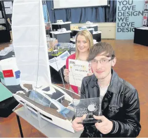  ?? ALISTAIR WILSON
AN144322 ?? Best in show at Yateley School’s design competitio­n went to Nicholas Morgan, pictured with teacher Sally Williams.