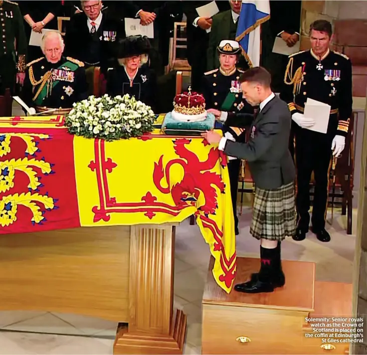  ?? ?? Solemnity: Senior royals watch as the Crown of Scotland is placed on the coffin at Edinburgh’s St Giles cathedral