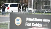  ?? GRAHAM CULLEN / THE FREDERICK NEWS-POST ?? Members of the Frederick Police Department Special Response Team prepare to enter Fort Detrick following a shooting in the Riverside Tech Park on Tuesday morning, in Frederick, Md.