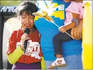  ?? Ross D. Franklin / Associated Press ?? Akemi Vargas, 8, cries as she talks about being separated from her father during an protest in Phoenix Monday.