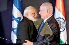  ??  ?? Indian Prime Minister Narendra Modi hugs Israeli Prime Minister Benjamin Netanyahu as they deliver joint statements during an exchange of co-operation agreements ceremony in Jerusalem on July 5. Reuters