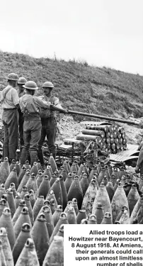  ??  ?? Allied troops load a Howitzer near Bayencourt, 8 August 1918. At Amiens, their generals could call upon an almost limitless number of shells