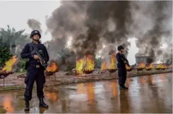  ??  ?? A total of 6.92 tons of illicit drugs are destroyed in Dehong Dai and Jingpo Autonomous Prefecture in Yunnan Province, southwest China, on June 26, 2019