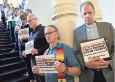  ?? JAY JANNER, AUSTIN AMERICAN-STATESMAN, VIA AP ?? Members of the clergy pray outside the House chamber in Austin in opposition to bills they consider anti-LGBT.