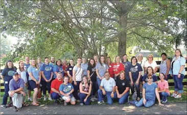  ??  ?? Included in the tour group were 29 Walker County schoolteac­hers; Roby Murray and Kyla Compton with GFB and Charles and Betts Berry, farm owners.