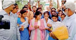  ?? — PTI ?? Girl students of Government High School celebrate in Rewari on Wednesday after the state ordered upgradatio­n of their school.