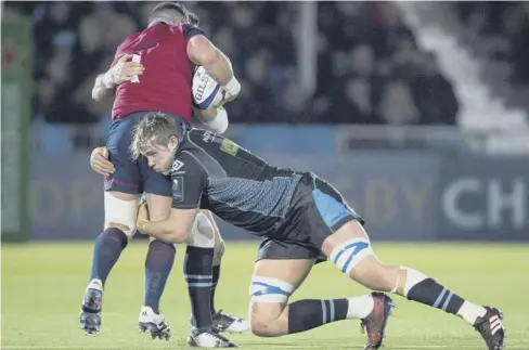  ??  ?? 0 Glasgow lock Jonny Gray, pictured making a tackle against Munster last weekend, has been praised for his ‘ phenomenal work rate’.