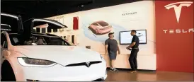  ?? PHOTO: BLOOMBERG ?? Tesla has reached a milestone critical to the chief executive Elon Musk’s goal to bring electric cars to the masses – and earn some profit in the process – by finally exceeding a long-sought production target with the Model 3.