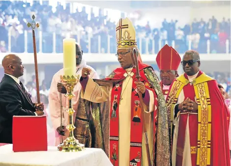  ?? Picture: EUGENE COETZEE ?? LAST DUTY: Anglican Church bishop of the Port Elizabeth diocese Nceba Bethlehem Nopece, centre, bows out with grace at his final church service at the Nangoza Jebe Hall in New Brighton on Sunday