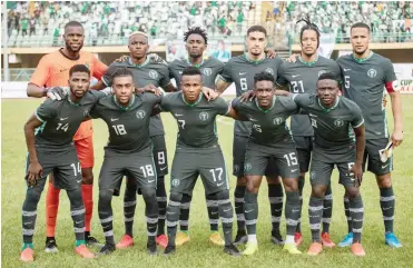  ??  ?? Line up of Super Eagles before their match against Crocodiles of Lesotho on Tuesday at the Teslim Balogun stadium Surulere, Lagos