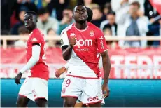  ?? — AFP photo ?? Monaco’s Youssouf Fofana celebrates with teammates after scoring his team’s first goal during the French Ligue 1 match against Lille at the Louis II Stadium in the Principali­ty of Monaco.