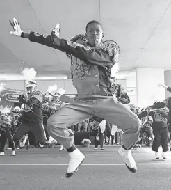  ?? 2013 PHOTO BY CHARLES SMITH/ AP ?? A Jackson State “Sonic Boom of the South” drum major performs during the annual homecoming day parade.