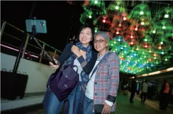  ??  ?? Residents celebrate the Macao Light Festival on December 1