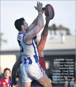  ??  ?? LEADER: Harrowbalm­oral’s Michael Close flies over Kalkee’s Blair Thomas. Close, with brother Simon, was rampant in the Roos’ 133-48 win. Picture: PAUL CARRACHER