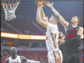  ?? Chase Stevens Las Vegas Review-Journal ?? UNLV forward Vitaliy Shibel goes to the basket past Southern Methodist’s Ethan Chargois in the first half of Saturday night’s nonconfere­nce game at the Thomas & Mack Center.