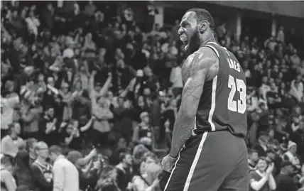  ?? AAron Ontiveroz, The Denver Post ?? LeBron James (23) celebrates the final horn against the Nuggets during overtime of Los Angeles' 120-116 win on Wednesday at Pepsi Center.