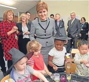  ?? Picture: PA. ?? First Minister Nicola Sturgeon meets children and staff during a visit to Tower View Nursery in Glasgow.