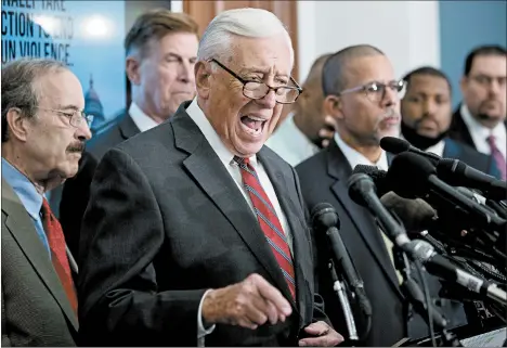  ?? ANDREW HARNIK/AP ?? Majority Leader Steny Hoyer of Maryland, center, and several of his Democratic colleagues focus Tuesday on ratcheting up gun control, an issue that largely unites their party.