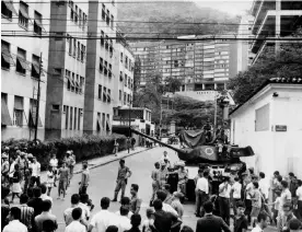  ?? Photograph: AFP/Getty Images ?? Brazilian army tanks stand in front of Laranjeira­s Palace, on 1 April 1964 in Rio de Janeiro during the military putsch that led to the overthrow of President João Goulart by members of the Brazilian armed forces.