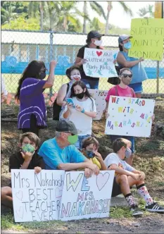  ?? The Maui News / COLLEEN UECHI photo ?? Students and supporters of Haiku kindergart­en teacher Monica Nakahashi stand Monday just outside the campus where Nakahashi was asked to leave Friday.