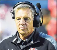  ?? Matthew Brown / Hearst Connecticu­t Media ?? New Canaan coach Lou Marinelli paces the sideline during an FCIAC football game against Trumbull in 2018 in Trumbull. New Canaan defeated Trumbull 48-7.