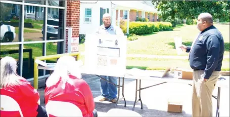  ?? ?? On Friday, April 22, the Clay County Emergency Management Agency held a 911 dispatcher appreciati­on ceremony with awards, gifts, certificat­es, and food. (Photo by Cal Brown, DTL)