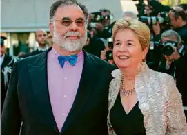  ?? VALERY HACHE/AFP VIA GETTY IMAGES/FILE ?? Ms. Coppola, with her husband, Francis Ford Coppola, in 2006. She documented the making of some of his films.