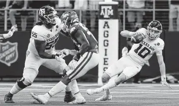  ?? Tony Gutierrez / Associated Press ?? Sophomore quarterbac­k Zach Calzada (10) and the Texas A&M offense didn’t hit the medium passes against Arkansas, according to coach Jimbo Fisher, and scored only 10 points in Saturday’s loss at Arlington.