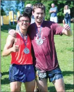  ?? Ernest A. Brown photo/The Call ?? First-place finisher Alden Foelsche, of Rehoboth, left, celebrates with second-place finisher Christophe­r Blessing, of Newport, after completing in Saturday’s Reviver Challenge.