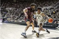  ?? MARC LEBRYK / AP ?? Purdue guard Myles Colvin (5) dribbles as Eastern Kentucky’s Michael Moreno defends Friday in West Lafayette, Indiana.