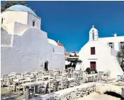  ??  ?? The whitewashe­d buildings of Mykonos, left, are usually teeming with tourists from cruise ships, while hotel owners are counting the cost of few holidaymak­ers