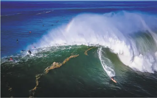  ?? Brian Feulner / Special to The Chronicle ?? Wilem Banks competes at Mavericks off the coast of Half Moon Bay, where ideal weather and favorable wind created monster waves Tuesday.