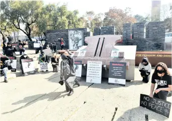  ?? | ITUMELENG ENGLISH ?? THE AHMED Kathrada Foundation picket at the Hector Hector Pieterson memorial in Orlando West yesterday to highlight the ongoing racism and brutality by law enforcemen­t officials globally, including in South Africa. African News Agency (ANA)