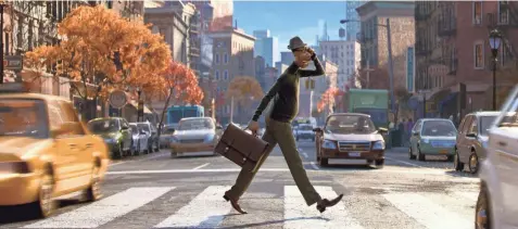  ?? COURTESY OF PIXAR ?? Joe Gardner (voice of Jamie Foxx) crosses the street in ‘Soul,’ the latest film from ‘Pixar.’