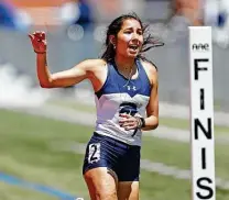  ??  ?? Boerne Champion’s Anastacia Gonzales set a strong pace and won the 800-meter run, setting a San Antonio-area record.