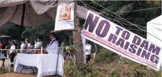  ?? Photo by Lauren Alimondo ?? OPPOSED. Residents from Barangays Poblacion, Dalupirip, and Tinongdan in Itogon, Benguet join the ecumenical mass near the opposed Tailings Storage Facility Dam 2 of Benguet Corporatio­n. These lower downstream communitie­s opposed the plans of the mining firm to raise the level of the dam.