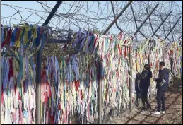  ?? AP ?? A woman wishes for the reunificat­ion of the two Koreas at the Imjingak Pavilion in Paju, South Korea, near the border with North Korea on Monday.