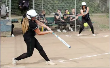  ?? PHOTOS BY MIKE BUSH/NEWS-SENTINEL ?? Elliot Christian batter Tabitha Lang hit for the cycle in Tuesday's CCAA softball game against Brookside Christian. That led to the Eagles to a 23-1 win over the Knights.