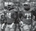  ?? ?? Ohio State offensive linemen Donovan Jackson (74) and Josh Simmons (71) line up for a play against Youngstown State last month.