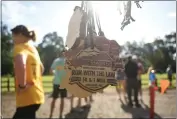  ?? ?? Medals were passed out to people who completed the “Run with the Law” race at Lower Bidwell Park.