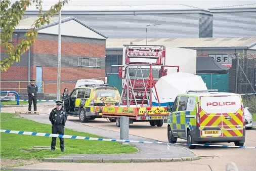  ??  ?? AFTERMATH: Police at the Waterglade Industrial Park in Grays, Essex, where 39 bodies were found inside a lorry container