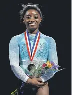  ?? WINSLOW TOWNSON/USA TODAY SPORTS ?? Simone Biles pointedly wore a teal-colored leotard Sunday at the national championsh­ips.