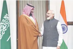  ??  ?? Indian Prime Minister Narendra Modi (right) shakes hands with Saudi Crown Prince Mohammed bin Salman prior to a meeting at Hyderabad House in New Delhi on February 20. – AFP photo