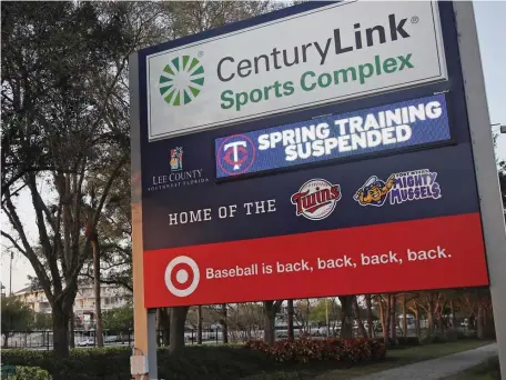  ?? AP ?? SUSPENDED: A sign outside Hammond Stadium reads "spring training suspended" after Thursday’s game between the Minnesota Twins and the Baltimore Orioles was canceled.