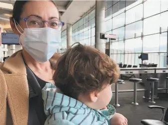  ?? Sarah Feldberg / The Chronicle ?? Chronicle Culture Desk editor Sarah Feldberg and daughter at Baltimore/ Washington airport.