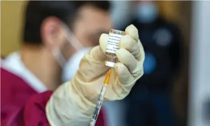  ?? Photograph: Alessandro Barone/Pacific Press/REX/Shuttersto­ck ?? A healthcare worker prepares a dose of the Pfizer/BioNTech vaccine.